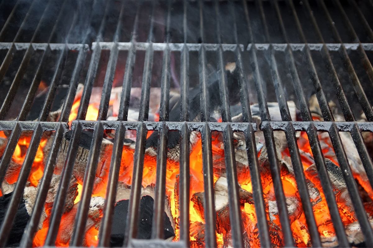 Adding Hot Coal To The Smoker